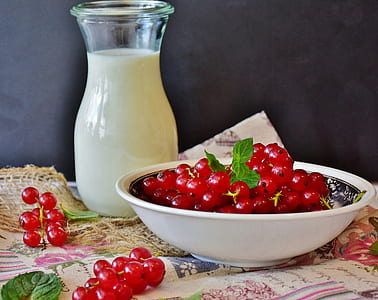 red grapes on white ceramic bowl