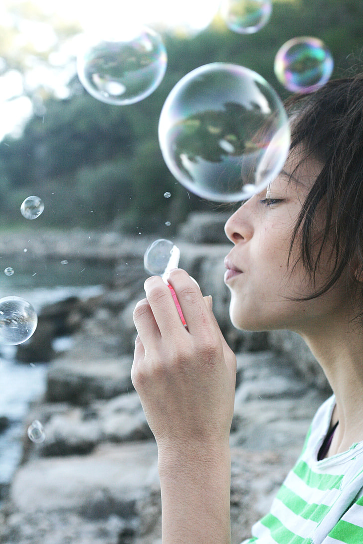 woman playing bubbles