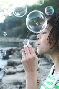 woman playing bubbles