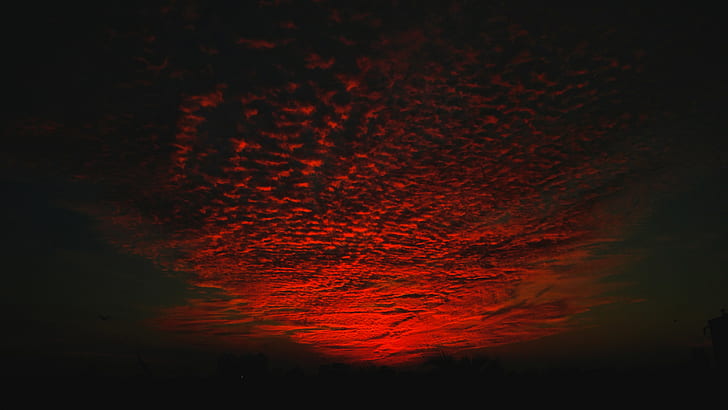 selective color photo of red cirrus clouds