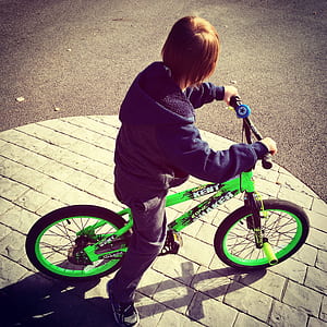 Boy Riding Bike at Daytime