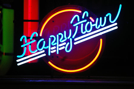 blue, yellow, and white Happy Hour neon sign