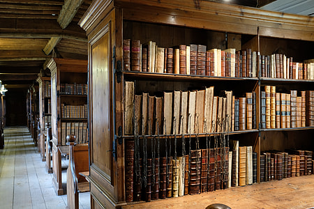 photo of brown wooden bookshelf with bookshelf