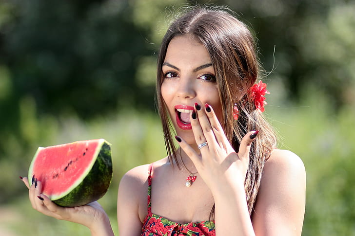 woman holding watermelon fruit