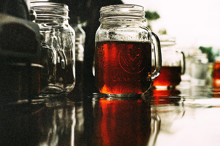 three clear glass mason jars