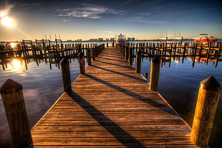 photo of brown wooden dock during daytime