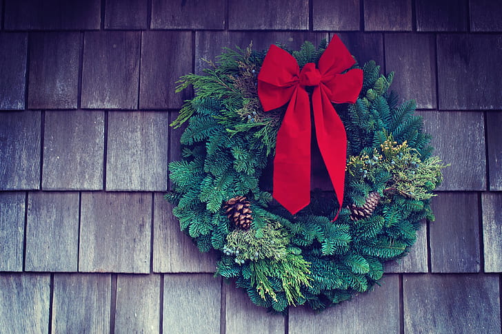 green wreath with red ribbon