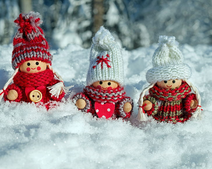 three mini figures on snow