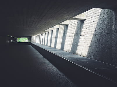 Sunlight Streaming Through Concrete Opening of Underground Passageway