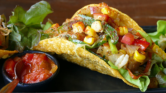 taco with vegetables and corn with sauce