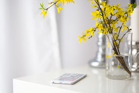 White smartphone with yellow flowers