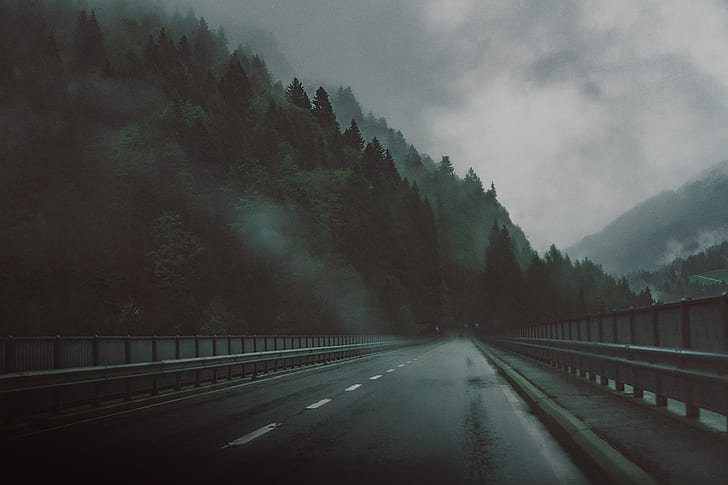 photo of dark road on mountain