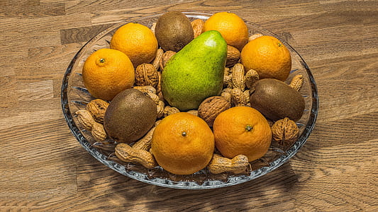 assorted fruit in glass bowl