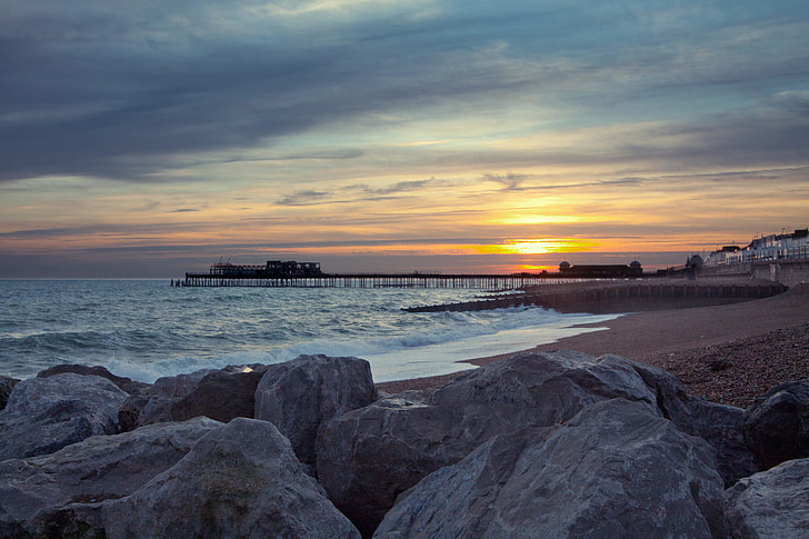 Wide angle shot taken at sunset of the pier and seafront at Hastings, East Sussex, England