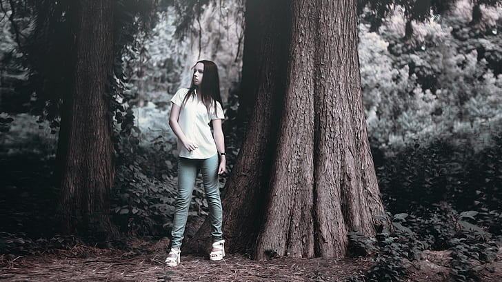 woman in shirt beside tree