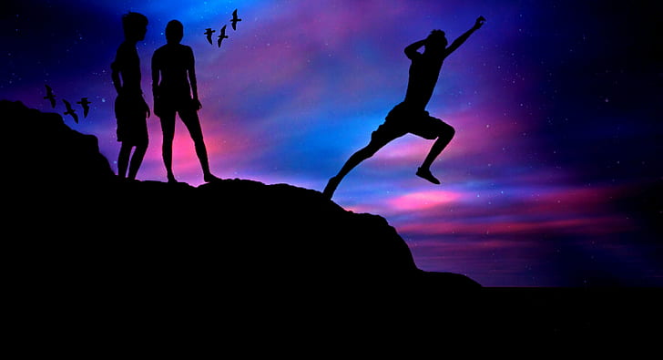 silhouette of man jumping on hill