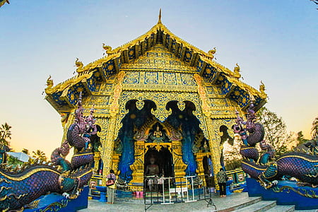 Photo of Gold-colored Altar With Dragon Figurines