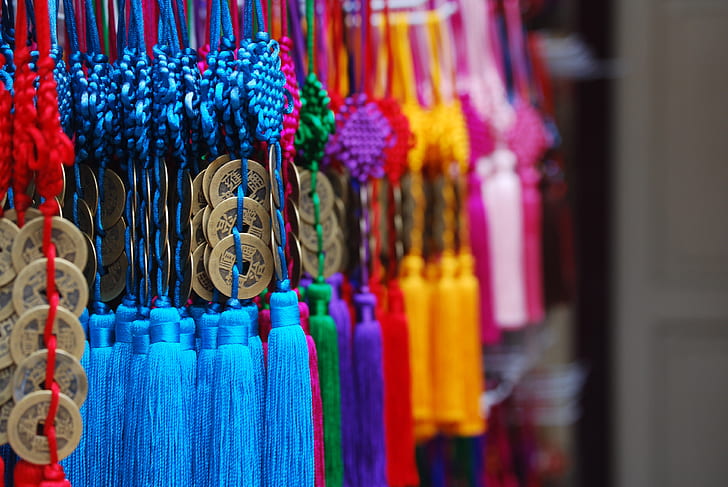 pile of assorted-color tasseled misbaha prayer beads