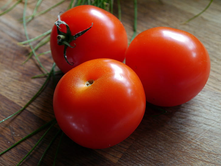 three ripe tomatoes