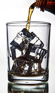 clear glass cup with ice cubes
