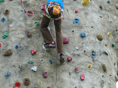 person wall climbing