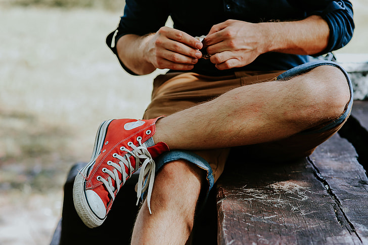Royalty-Free photo: Man in a red sneaker shoes | PickPik