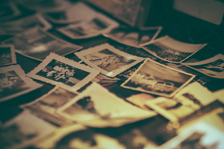 scattered sepia photographs on the floor