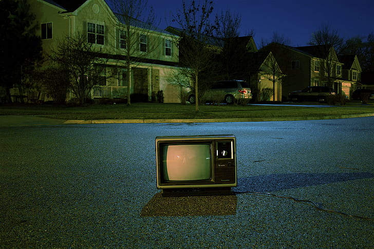 vintage TV on gray cement road