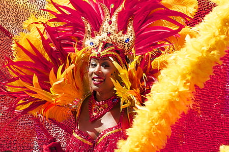 woman wearing red and yellow costume smiling