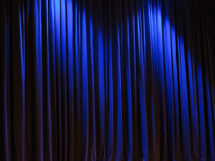 closeup photo of blue silk curtain