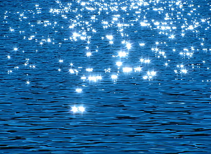 bokeh lights photograph of body of water