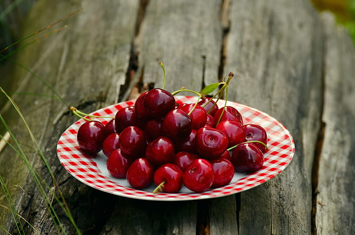 bunch of cherries on plate