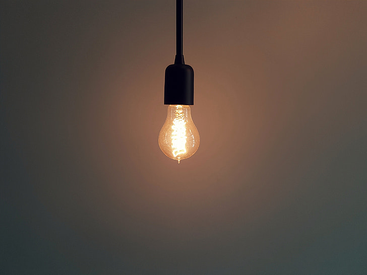 selective focus photography of turned on light bulb