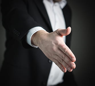 selective focus photo of man's hand