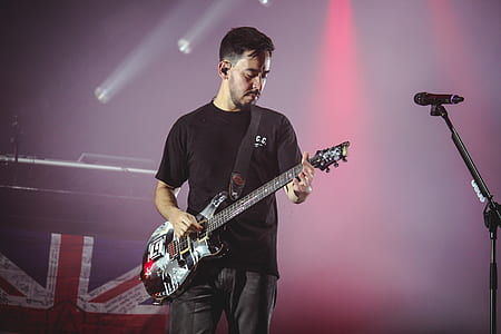 Man Wearing Black T-shirt And Playing Electric Guitar