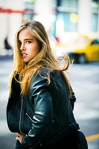Woman Wearing Black Leather Jacket Facing Backward