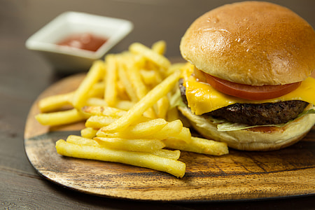 Cheeseburger, fries and ketchup sauce