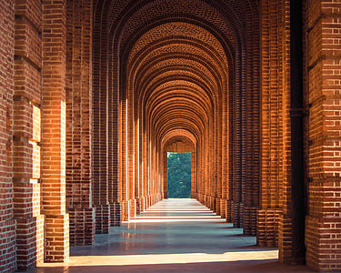 pathway inside brown brick building