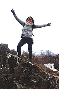 Woman Standing on a Rock Wearing Bubble Jacket