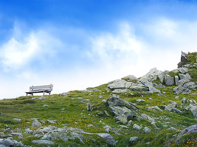 White Wooden Bench in Mountain during Daytime