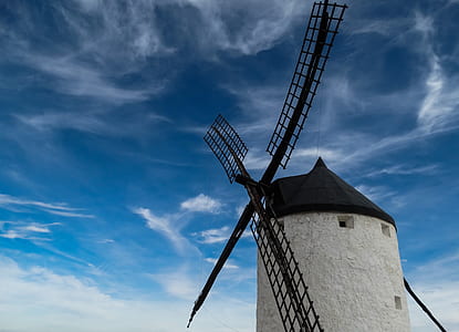 white and black windmill tower during daytime