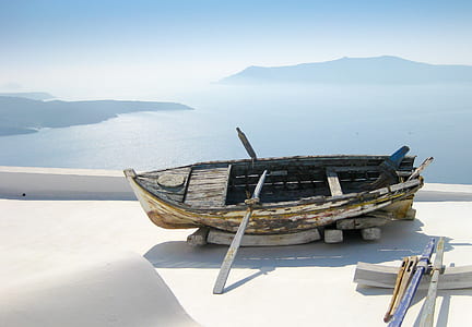 wooden boat on white surface