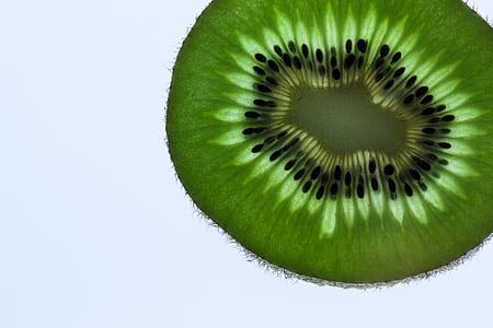 green and black sliced fruit