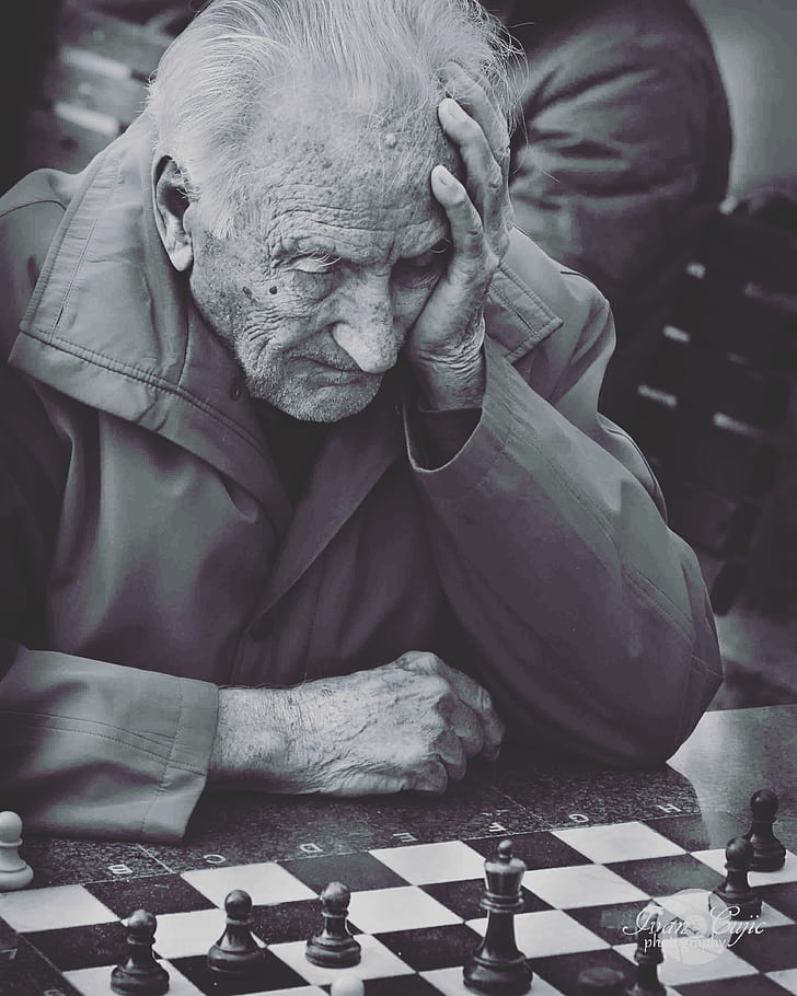 Caucasian man playing chess computer hi-res stock photography and