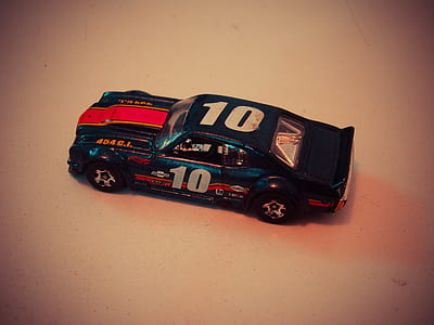 Teal Red and White Die Cast Model of Racing Car