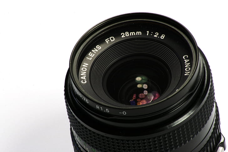 black Canon Lens FD 28mm 1:2.8 camera lens