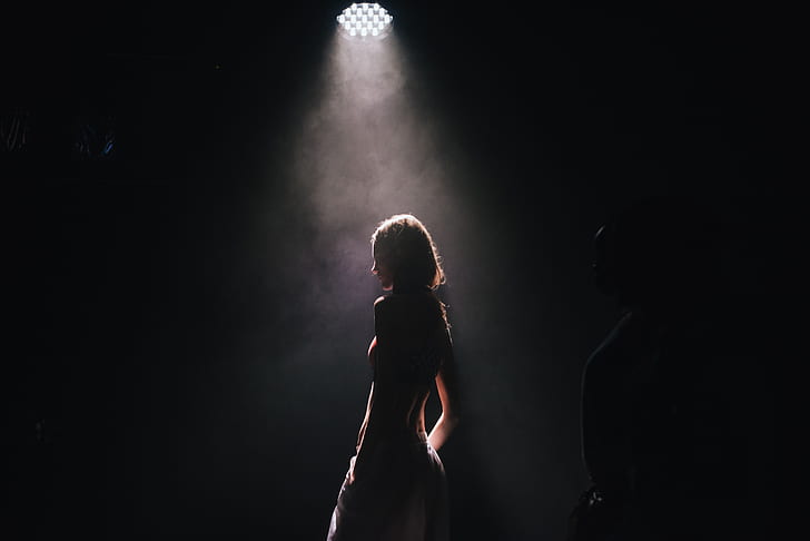 woman standing with white light photography