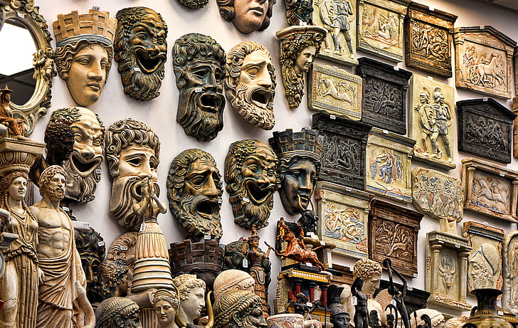 assorted head figurines and wall art decors