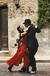 man and woman dancing during daytime