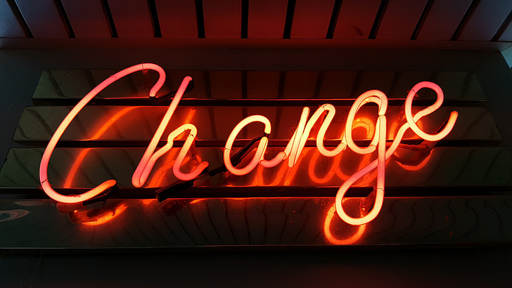 close up photo of red Change neon light signage